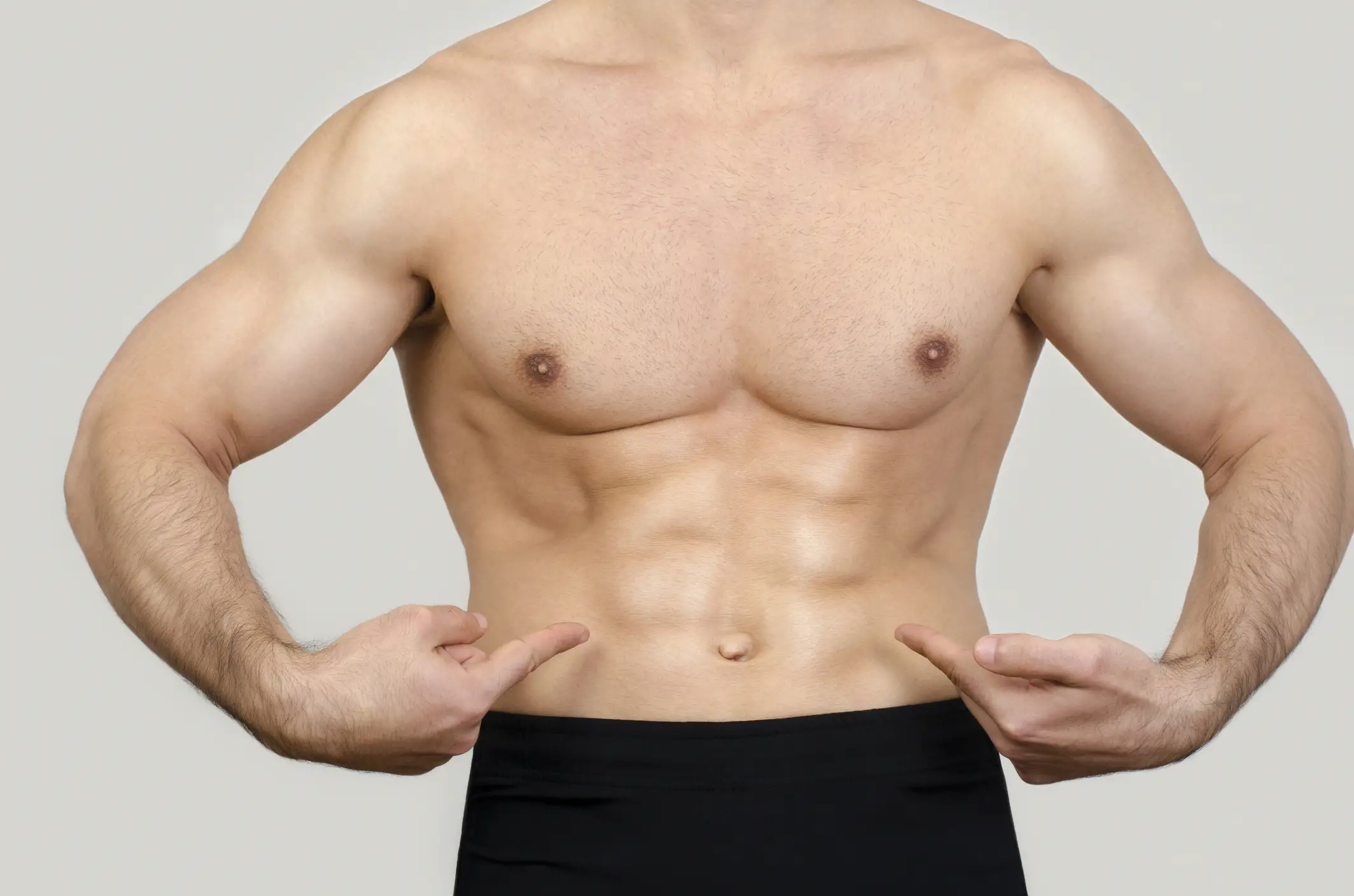 Man gaining muscle growth whilst retaining a six pack