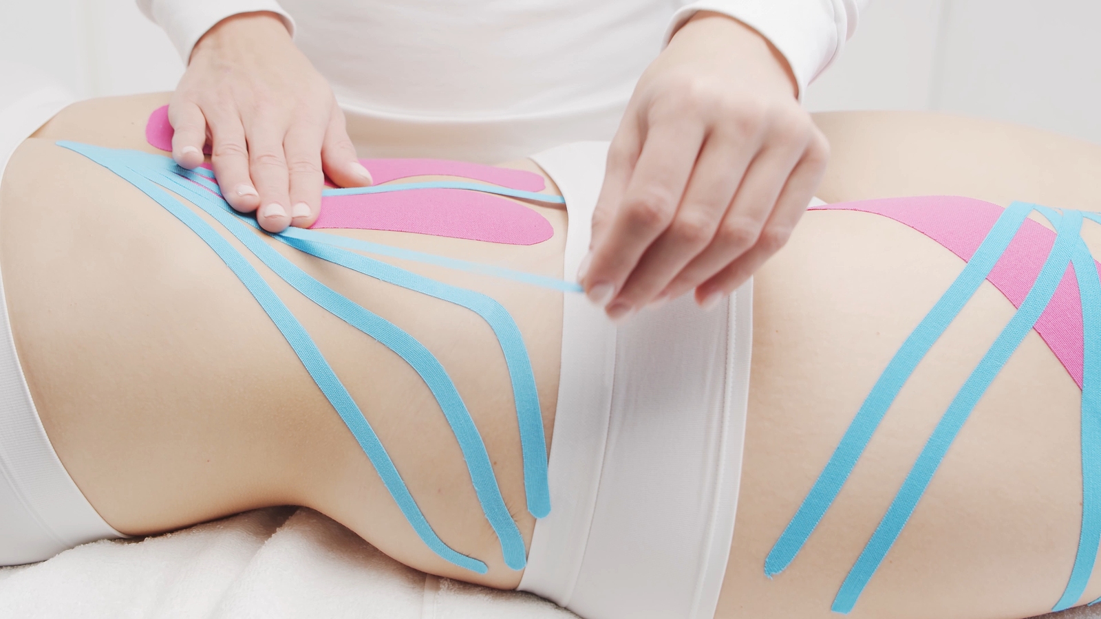 Therapist Is Applying Tape To Female Body. Physiotherapy, Kinesi