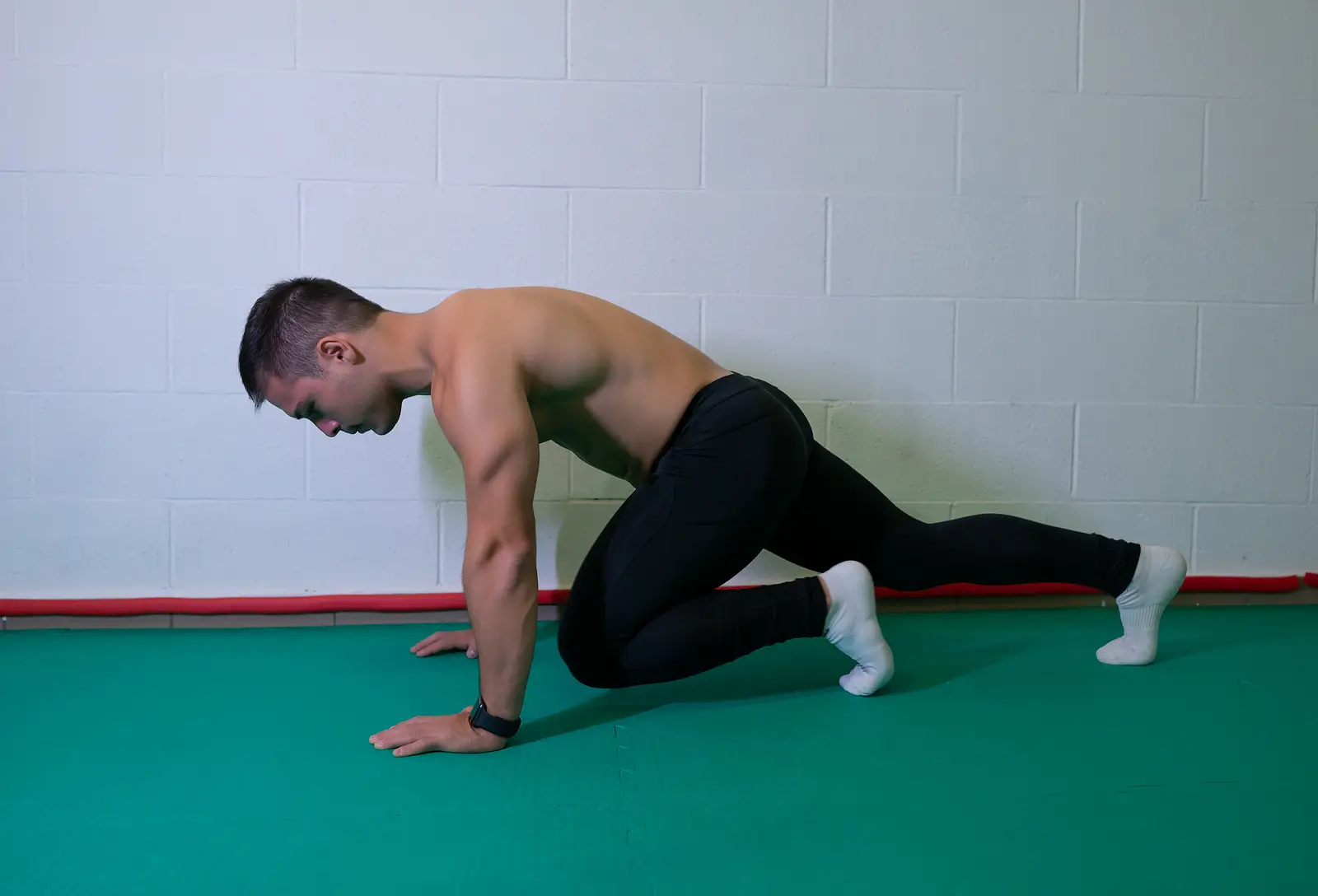 Handsome Muscular Guy With Bare Torso Is Doing Mountain Climbers