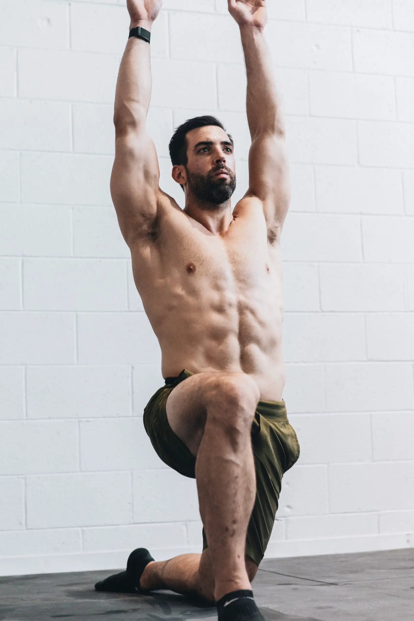 Man flexing and stretching to avoid any injuries