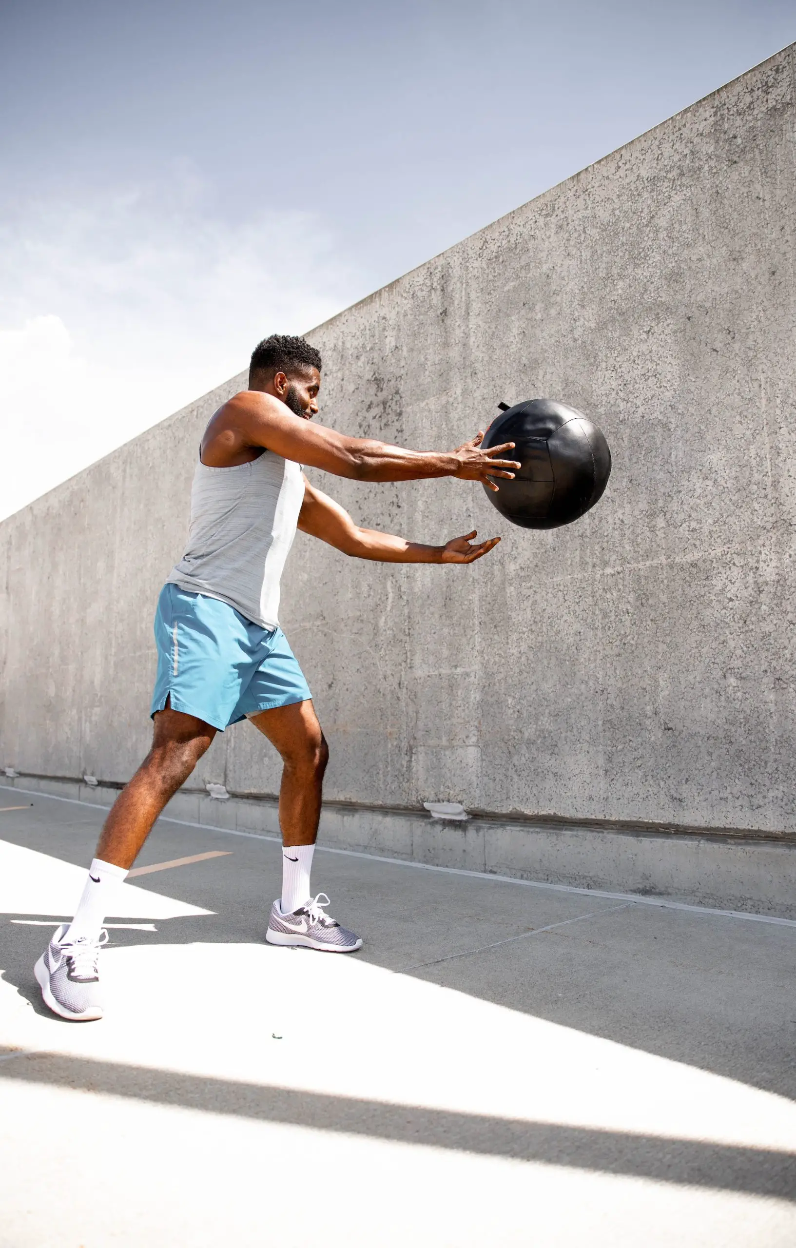 Man using a fitness ball as part of his HIIT workout