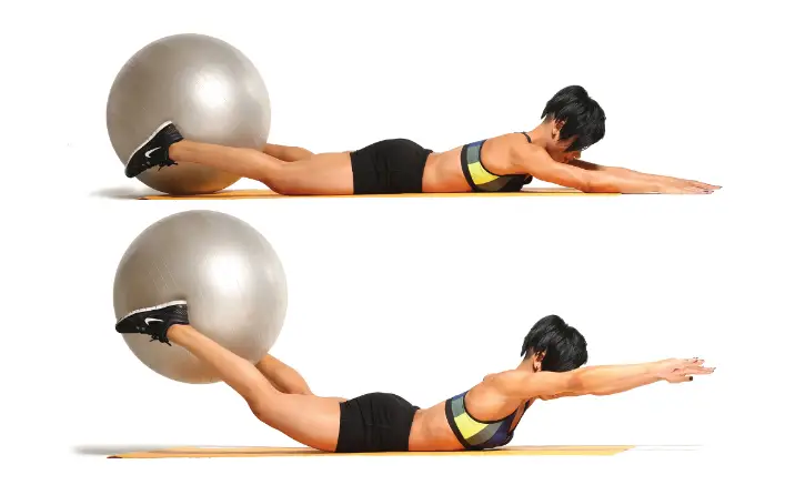 Woman doing a squeeze curl lift with a fitness ball