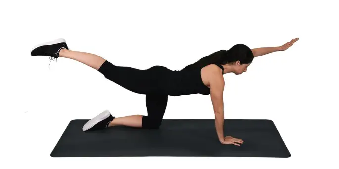 Woman performing a swimmer exrecise for a stronger core