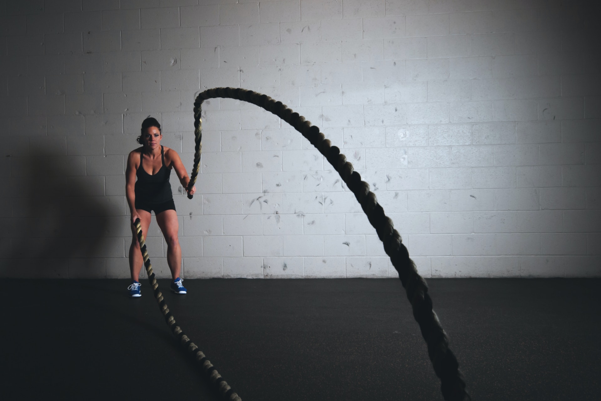 Woman using ropes to build core strength