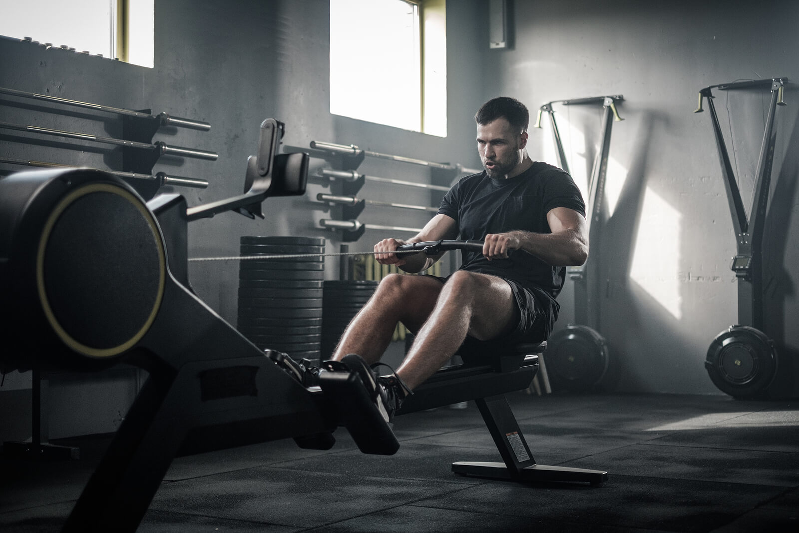 Serious Strong Male Finish Training With Rowing Machine .